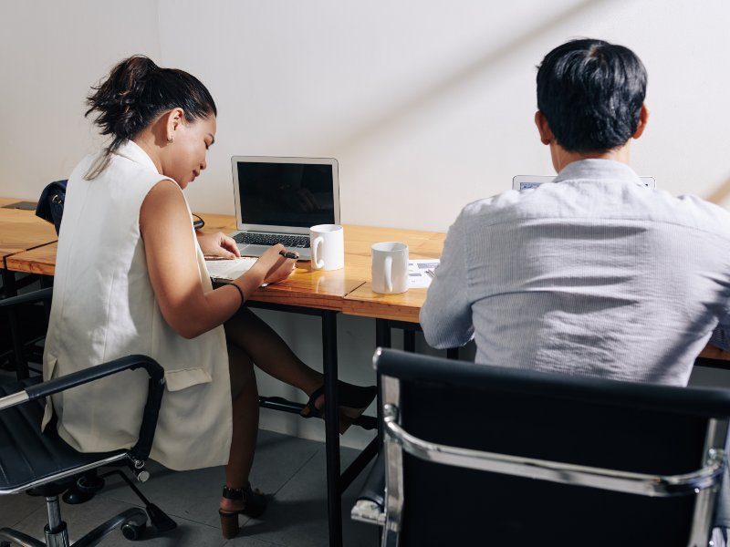 Businesswoman checking her plans when colleague who is sitting next to her working on laptop SSUCv3H4sIAAAAAAAACpxUyY7cIBC9R8o/tDgHiX3Jf+QU5YANdKNxm5aNs2g0/x684ME96RkpB0v2q6pHvaL8nj9/Op1AY8bQgq+n5/krf4eum8Y0mBRin2H0ZcMH11s31IizIcUhmK4GG5PaS2+uLoP91HUz/LIEwZhMmkY3VofZwZnrmMKSjguHsbFxY4rtU0ZpQW+xt7wGTGeuf+q62yWmaKfeHcrC72TqrPEypeSGN/xNOC/YwlIHMKGDr4HW9MfMSmRrkjvnqRxklhl/X79PJbCxpRwCYGNfe5yaBSvQSv5flevLj31oZ9e389R2on2Oe3enO07aCqGUaaCXbQtZ6xFUQjioMc4RR1Dj0X5gOen+Hmt2jLAg/6o47MPDfqQ+fB641peX6kYG1zmzrt3GCFpPlbeMQ0c5g0x6BxuS35qmxUQQqox35QjgsTQsi4RYYQGZNwYqLyX0BjlCc4FBdE9GyjrPsYeYMA+Zcx6axirouaHYEu84W5tdRYOnX3kVr8uubO2ayYZY7c7P2JpuvNuy2xDa0J+rspguy99Zyto49WmYr3WfHehivJmmm2frM6cr+MWMY063Ba/XOXtBvFbn9DEto9xYgc37Pn9iSrCQVHKJqCRIaAbqv/4SMs/STmlwunXRWGcPq3j0Ay4JYRhR+mCl9gT9mlBcosQYr4qLYZRYXVdsYolxTIujvXWMLYXUKffmseZIpovtVD6yxDiWomrt3lLWHJlb3BZ6d6+puYbczXFutfNt6ggm7yuYH/HeZPPzoUSuqSIPps81Y+IDiWK+hwcjEpRr8vZ/XkiCrf11PMoD37BCDHNOmNqX/6APEK2kknlh9/i9PEApIkgKjfeUog5grKTWVL6G7sUByXIlVmTPKNLyjptz7MM1O/GINUYII8UWT9gEhvlugWk8FkJ7yJFT2UlQA5UkFjJGGKPYI81Frnr5CwAA//8DAFG5PETGBwAA